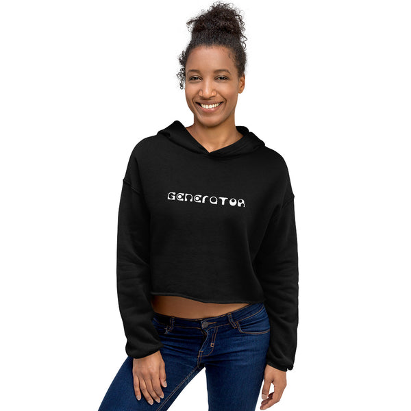 A smiling woman casually wears a black cropped hoodie sweatshirt with the word Generator printed in white on the chest