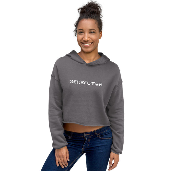 A smiling woman casually wears a gray cropped hoodie sweatshirt with the word Generator printed in white on the chest